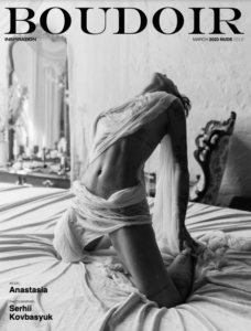 Black and white photo on the cover of Boudoir magazine. A model poses in flowing fabric, kneeling on a bed. Text reads: "BOUDOIR," "INSPIRATION," "MARCH 2023 NUDE ISSUE," "MODEL Anastasia," "Photographer Serhii Kovbasyuk," shot in Orlando.